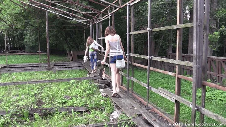 Two beauties Anastasia and Lily barefoot in a city park (Part 4 of 5)