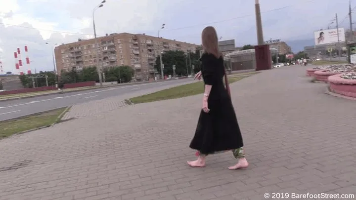 Mature hippie girl Olga walks barefoot in a dirty city on a rainy day (Part 5 of 6)