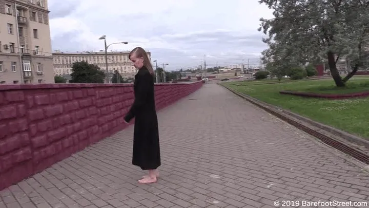 Mature hippie girl Olga walks barefoot in a dirty city on a rainy day (Part 3 of 6)