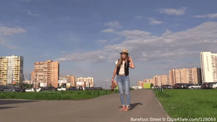 Beautiful Elena walks in city in straw hat (Full)