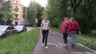 Alice walks barefoot in the city on a cold and rainy day (Part 2 of 5)