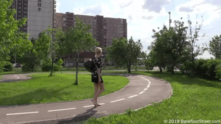 Mature barefoot girl Eva on a sunny street (Full)