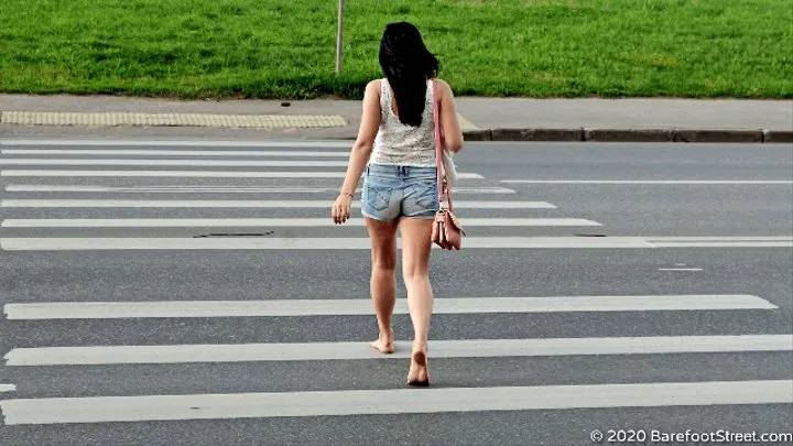 Olga walks barefoot in the city and draws with chalk on the asphalt (Part 1 of 6)