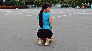 Cute oriental girl Ainura barefoot in a dirty parking (Part 5 of 6)