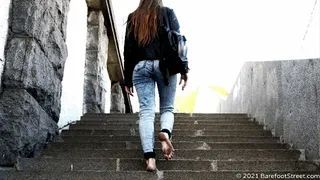 Young beautiful singer Anna walks barefoot along the sunny city streets (Part 6 of 6)