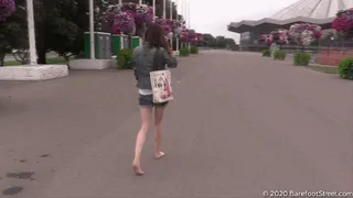 Serious girl Margo walks barefoot in the city on a cloudy day (Part 1 of 6)