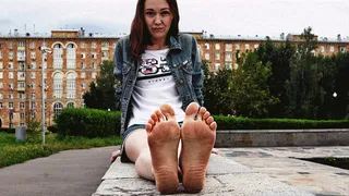 Serious girl Margo walks barefoot in the city on a cloudy day (Full with 33% discount)