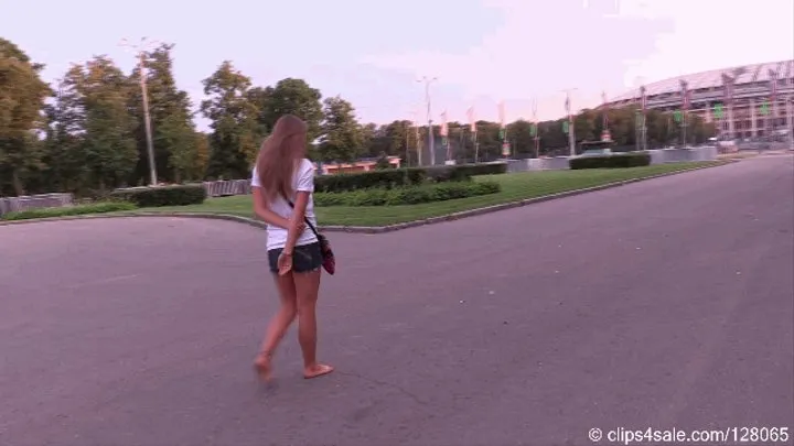 Beautiful Artemeda walks barefoot on the evening street (Part 2 of 7)