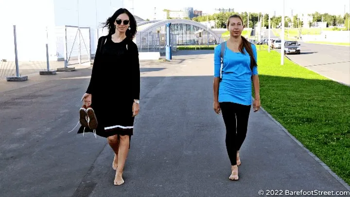 Anastasia and Kristina with huge feet barefoot on an asphalt field (Part 1 of 4) #20220420