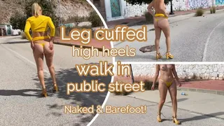 Leg cuffed high heels walk in public street