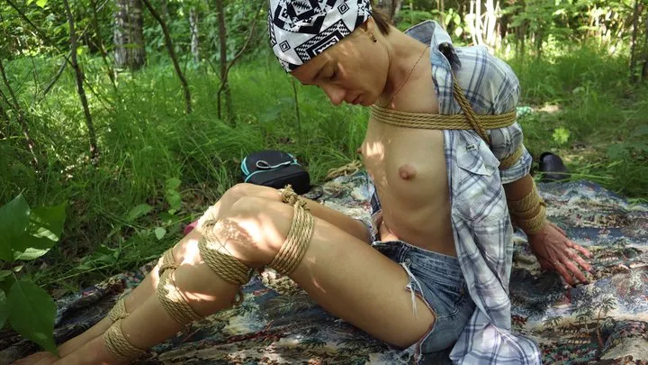 Sofi in a shirt tied with jute ropes in the forest  Part 2