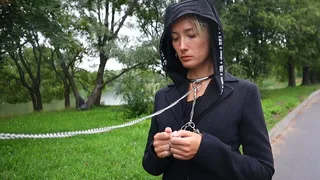 Sofi  Bondage walk in handcuffs in an amusement park