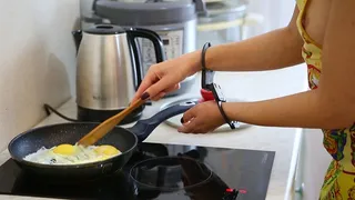Sofi cooks scrambled eggs in handcuffs