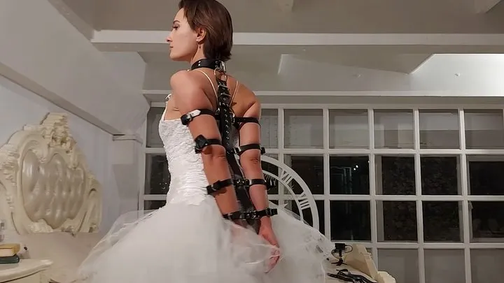 Bondage of Sofi with leather garters and bracers in a wedding dress  Tel