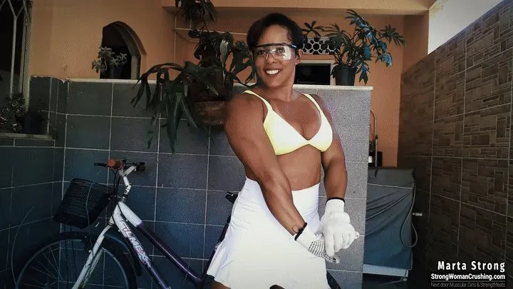 Marta strong flexing in yellow bikini