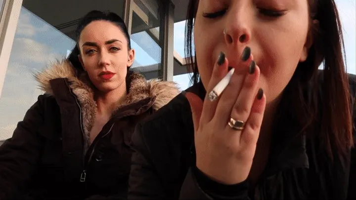 2 hot girls share a cigarette & blow smoke in your face