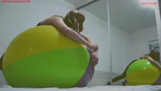 Alla deflates a large beach ball with a loud hissing sound