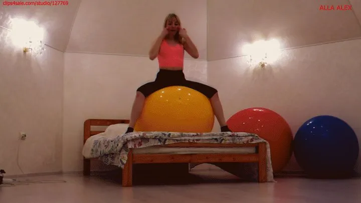 Alla happily jumps and does gymnastics on huge fitness balls