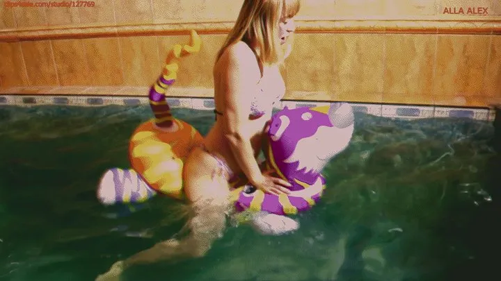 Alla hotly fucks while riding a rare inflatable tiger in the pool and inflates a beach ball with her mouth