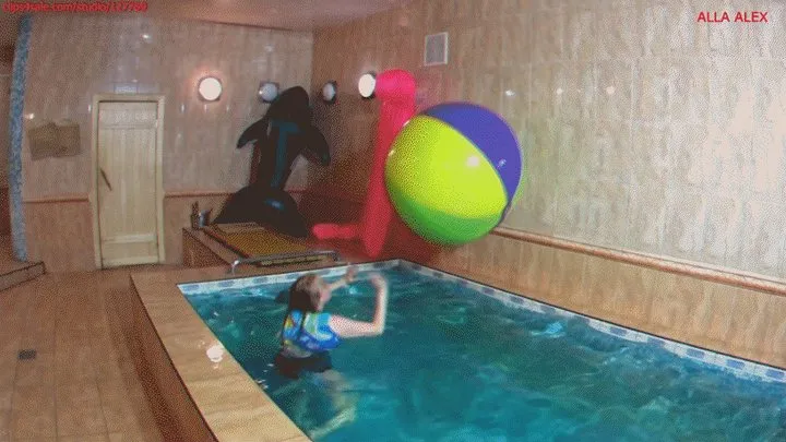 Alla plays in the pool with a large beach ball and blows it away!!!