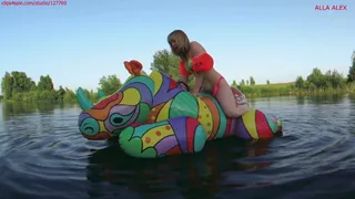Alla is riding with great pleasure on a big bright squeaky inflatables rhino on the lake!!!