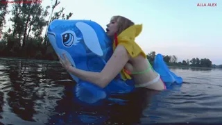 Alla rides on an inflatable squeaky inflatable whale and gets real pleasure, but falls into the water and is saved with the help of an inflatable airline vest!!!