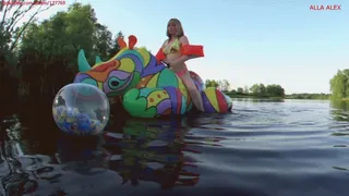 Alla inflates a small beach ball with feathers with her mouth and rides on an inflatable bright unicorn!!!