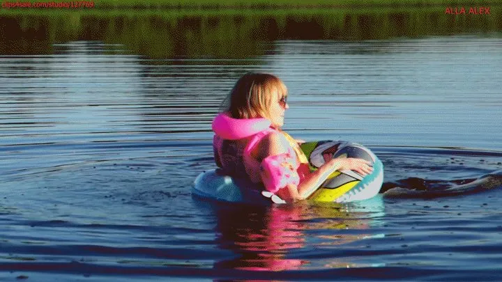 Alla swims in a rare inflatable ring on the lake and wears an inflatable vest for safety!!!