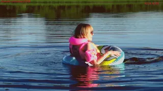 Alla swims in a rare inflatable ring on the lake and wears an inflatable vest for safety!!!