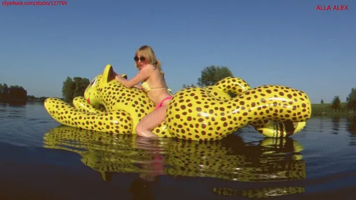 Alla has a hot ride on a tight, squeaky inflatable cheetah on the lake!!!