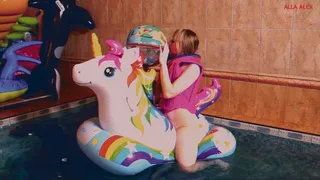 Alla naked rides an inflatable unicorn in the pool and inflates a beach ball with her mouth and plays with it!!!