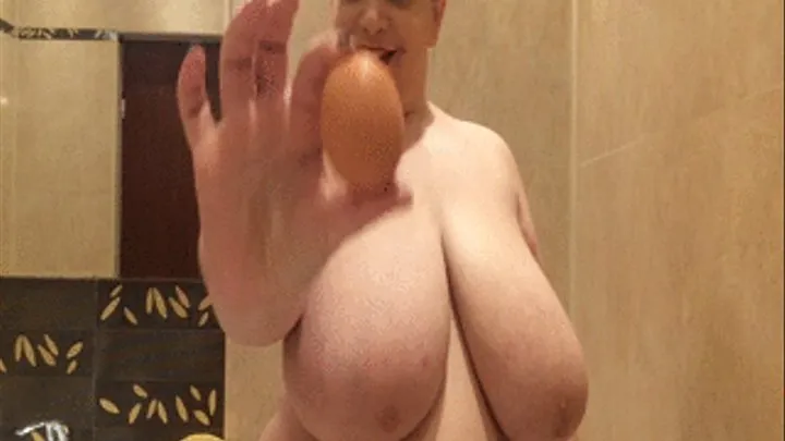 Cracking eggs on my huge boobs