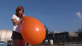 Titi blowing giant balloon