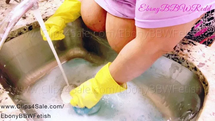 BBW cleaning and scrubbing her kitchen sink