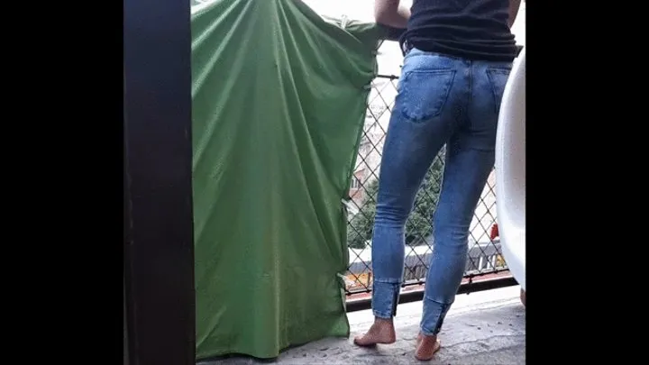 How we make video Desperate Pee in Jeans on balcony in centrum City