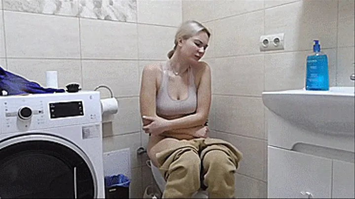 The blonde had a big stomach twist and she barely managed to get to the toilet!