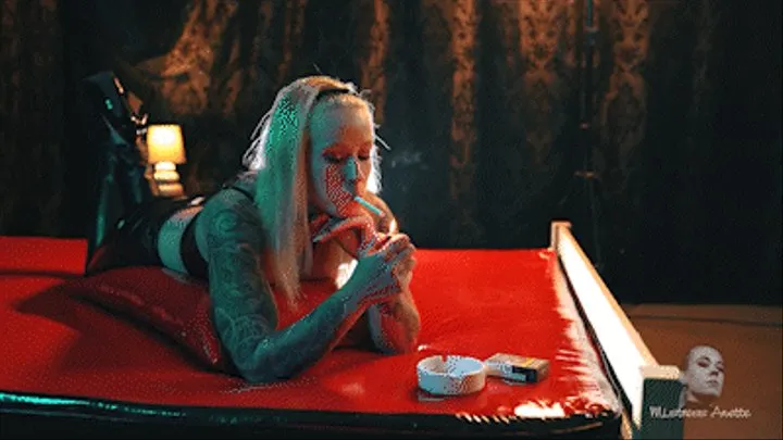 Smoking on the red pvc bed