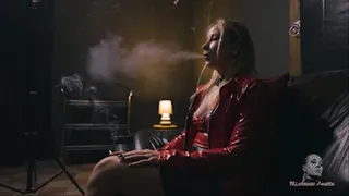 Smoking in her red jacket