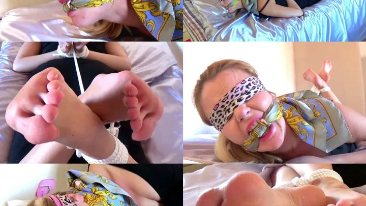 Karen hogtied, scarf gagged & blindfolded with her bare feet on show