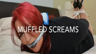 Hogtied red head, mouth stuffed and cleave gagged