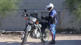 Motorcyclist babe strip tease, nipple sucking and eating ass