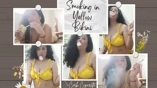 smoking two cork in yellow bikini and two different pose