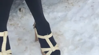 Dasha Kelly is wearing open toe High Heels sandals that sank deep into the white soft snow, she almost fell