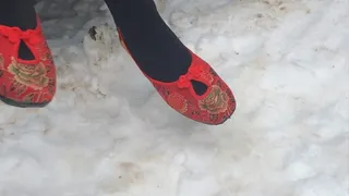 Dasha Kelly is wearing a pair of red ballerina flat shoes that sank deep into the white soft snow, she is lost and afraid in the winter freezing cold