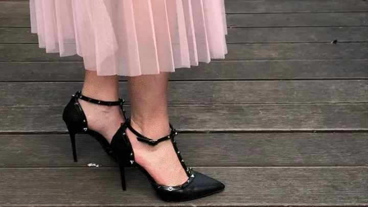 Sexy high heeled sandals stuck in a grate Struggling to get unstuck but it's impossible to move!!!