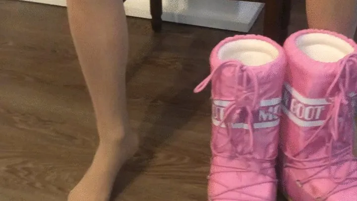 Dasha Kelly is wearing a pair of moon boots light stockings and a lace pink sexy thong she likes to slip the boots really slowly and to rub with her feet