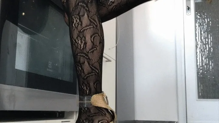 Dasha Kelly is in the kitchen cooking she is in a rush and she taps her heels hard she use the oven and the pan she is wearing lace stockings and super high heels