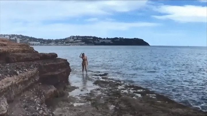 Oiling Up On The Beach