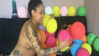 surrounded by balloons and masturbating