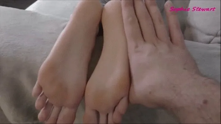 Touching her big slender feet